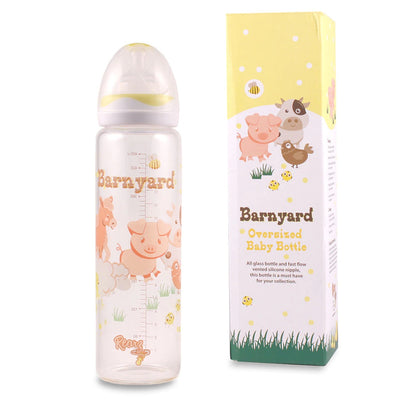 The Barnyard Glass Adult Baby Bottle sitting next to its box.