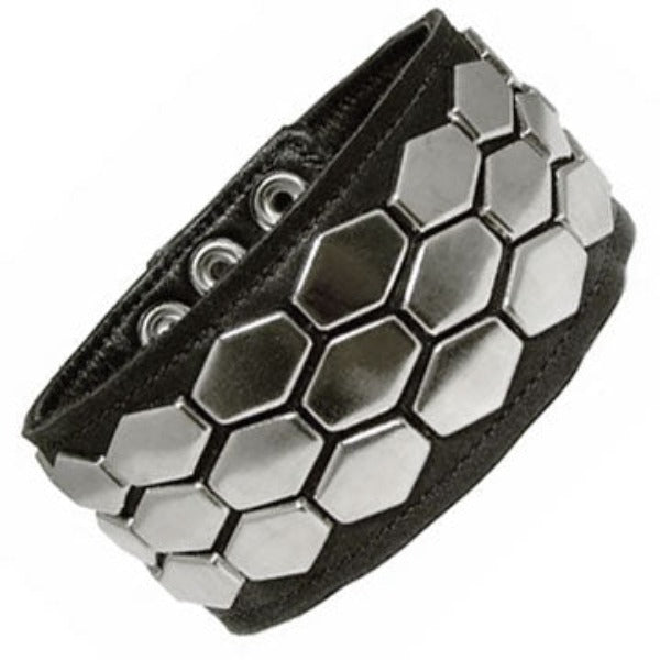 Black leather armband with three rows of elongated hexagonal plates,  forms a honeycomb shape.
