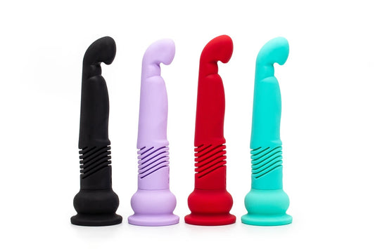 Four Teddy GS Thrusting Dildos of different colors lined up together.