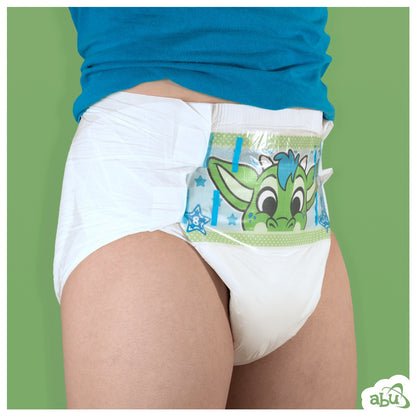 Front/side view of diaper on model with green dragon character printed on front.