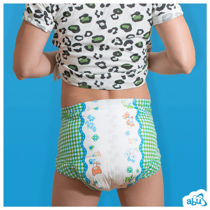 Rear view of diaper on model with puppy print on white on center and green/white plaid print on sides.