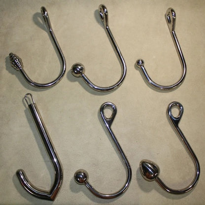 An assortment of six rope hooks.
