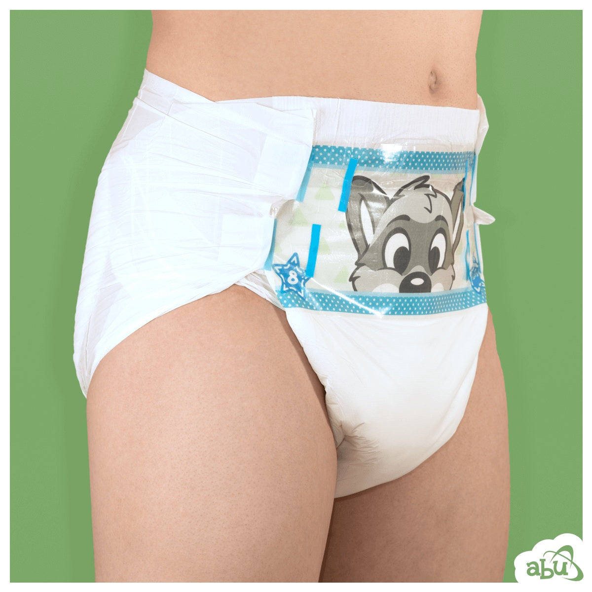 Front/side view of diaper on model with grey raccoon character printed on front.