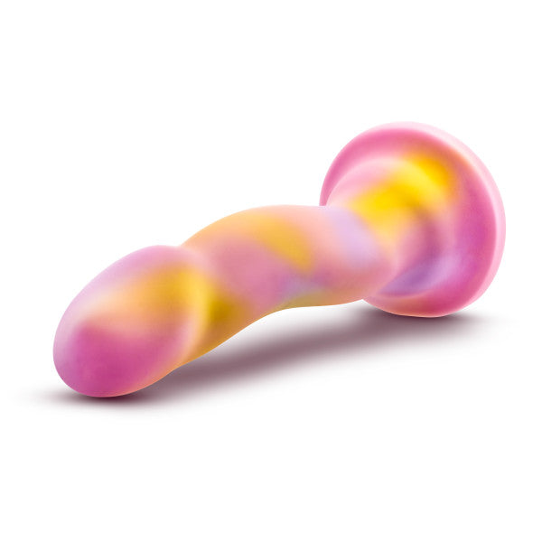 The Avant Suns Out Pink Dildo lying on its side with the head pointed toward the front.