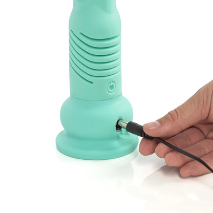 A closeup of the charging cable entering the Teddy GS Thrusting Dildo.