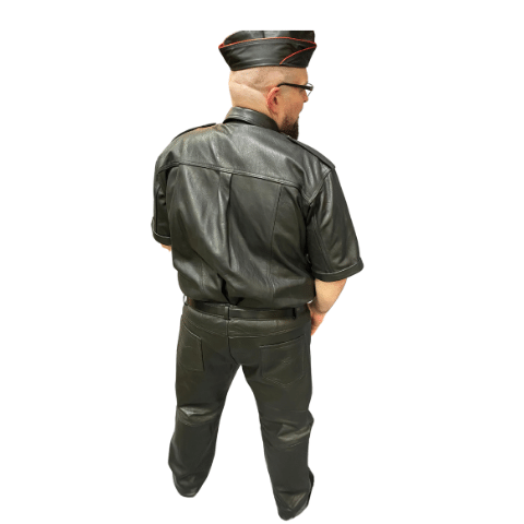 Back view of model wearing cowhide Levi jeans , leather short sleeve shirt, and leather garrison cap with red piping