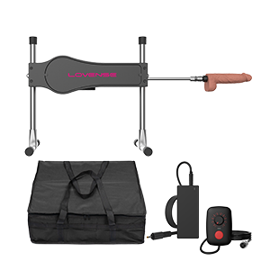 The Lovense Bluetooth Sex Machine with a dildo attached to the end of it next to its discreet carrying case.