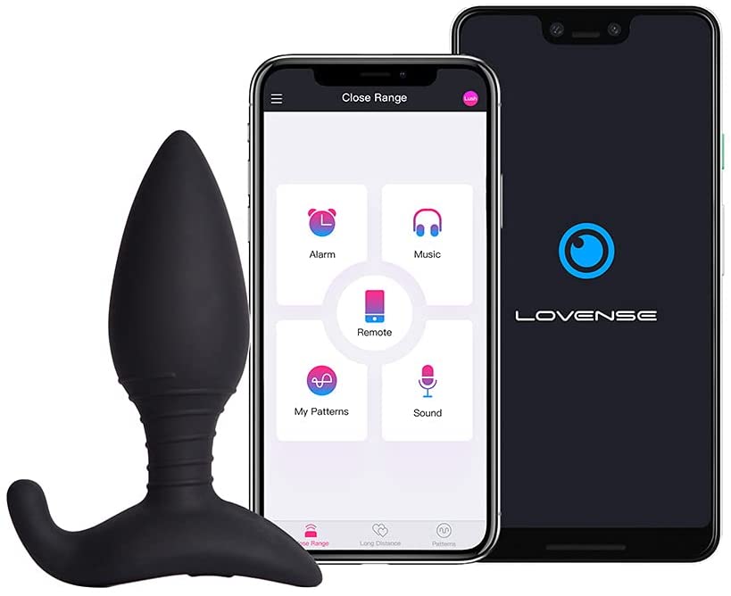 The Lovense Hush 2 Bluetooth Butt Plug Vibrator sitting next to a smartphone that shows its app.