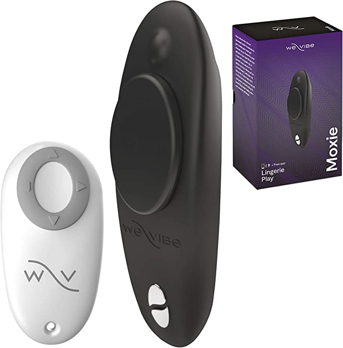 The Black We-Vibe Moxie+ Wearable Clitoral Vibrator next to its remote and packaging.