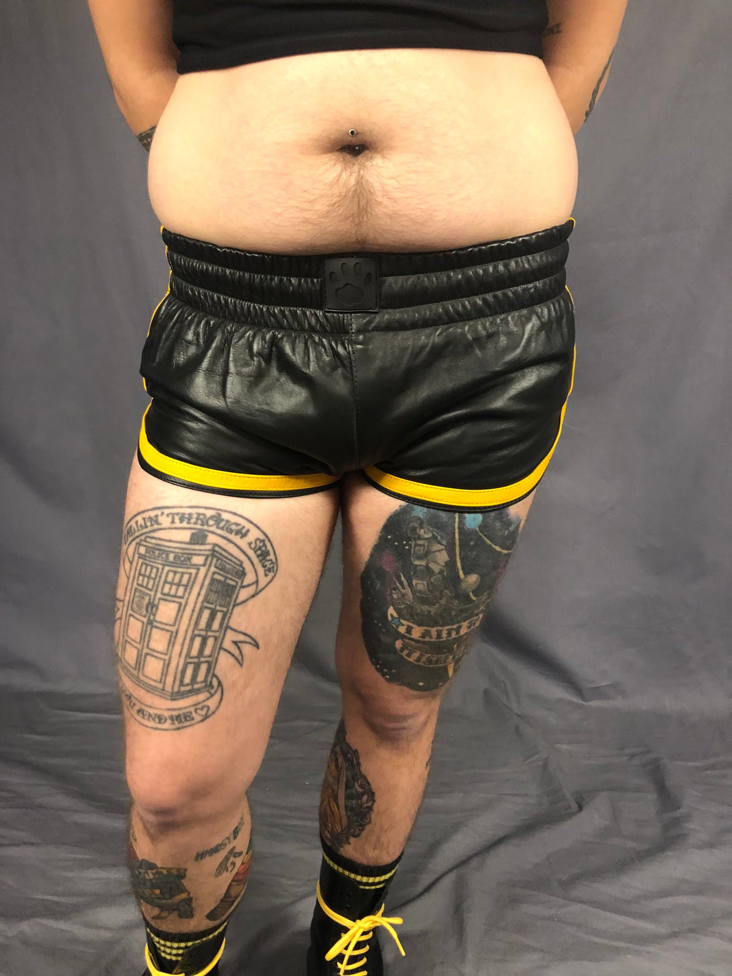 Close up of the front of the black and yellow prowler leather sport shorts.