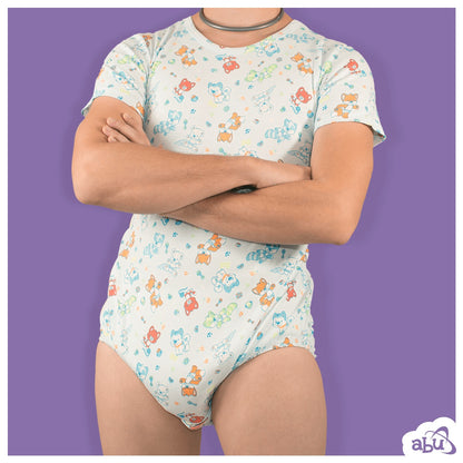 Front view of model wearing LittlePawz print diapersuit with disposable diaper worn underneath.