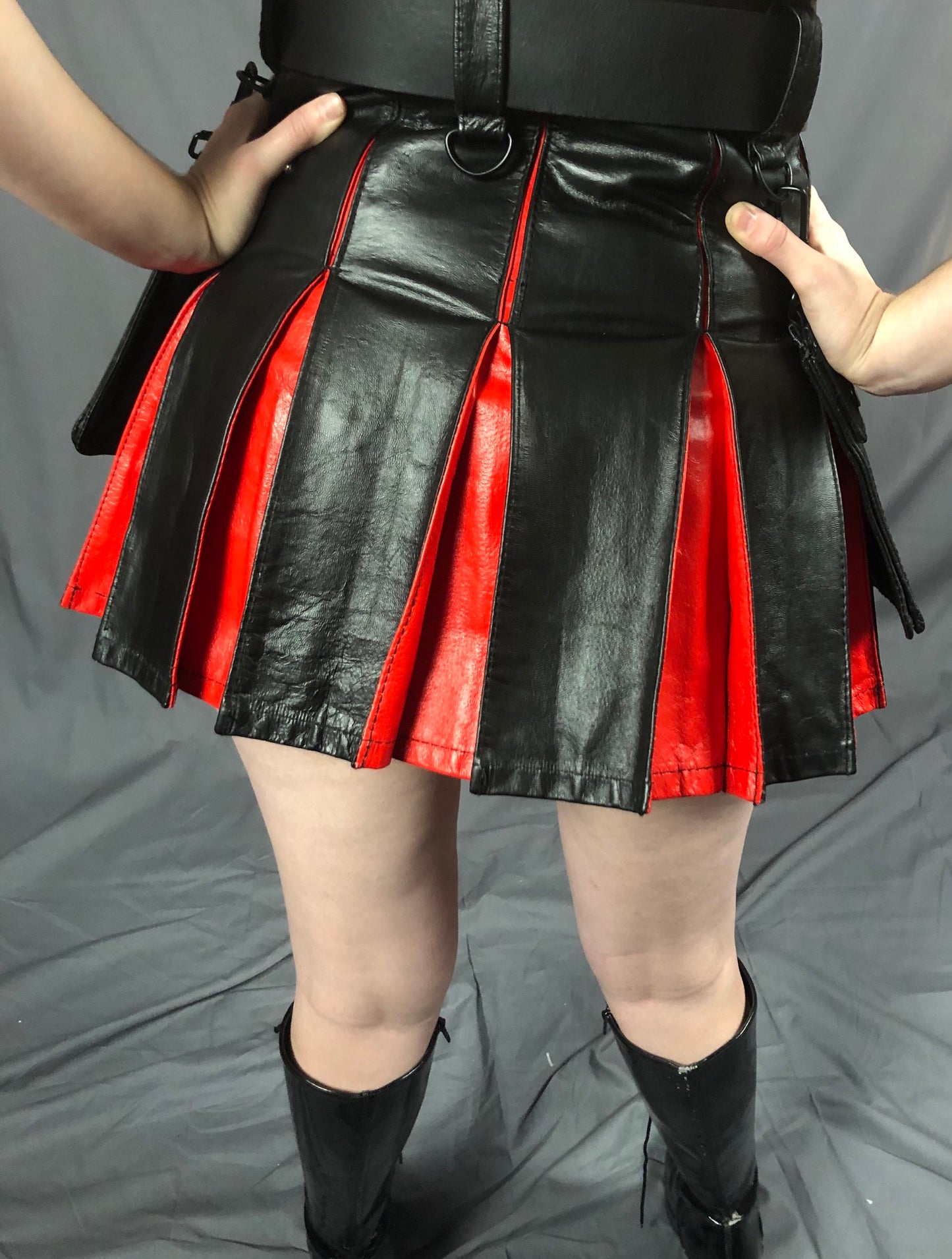 Black and Red Mini Cowhide Contrast Pleat Kilt, rear view.