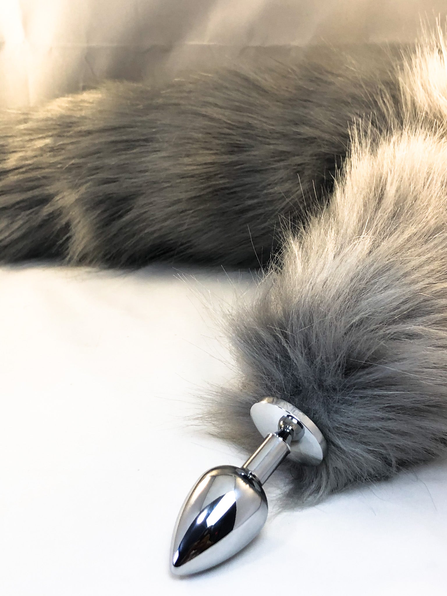 Faux gray fur tail