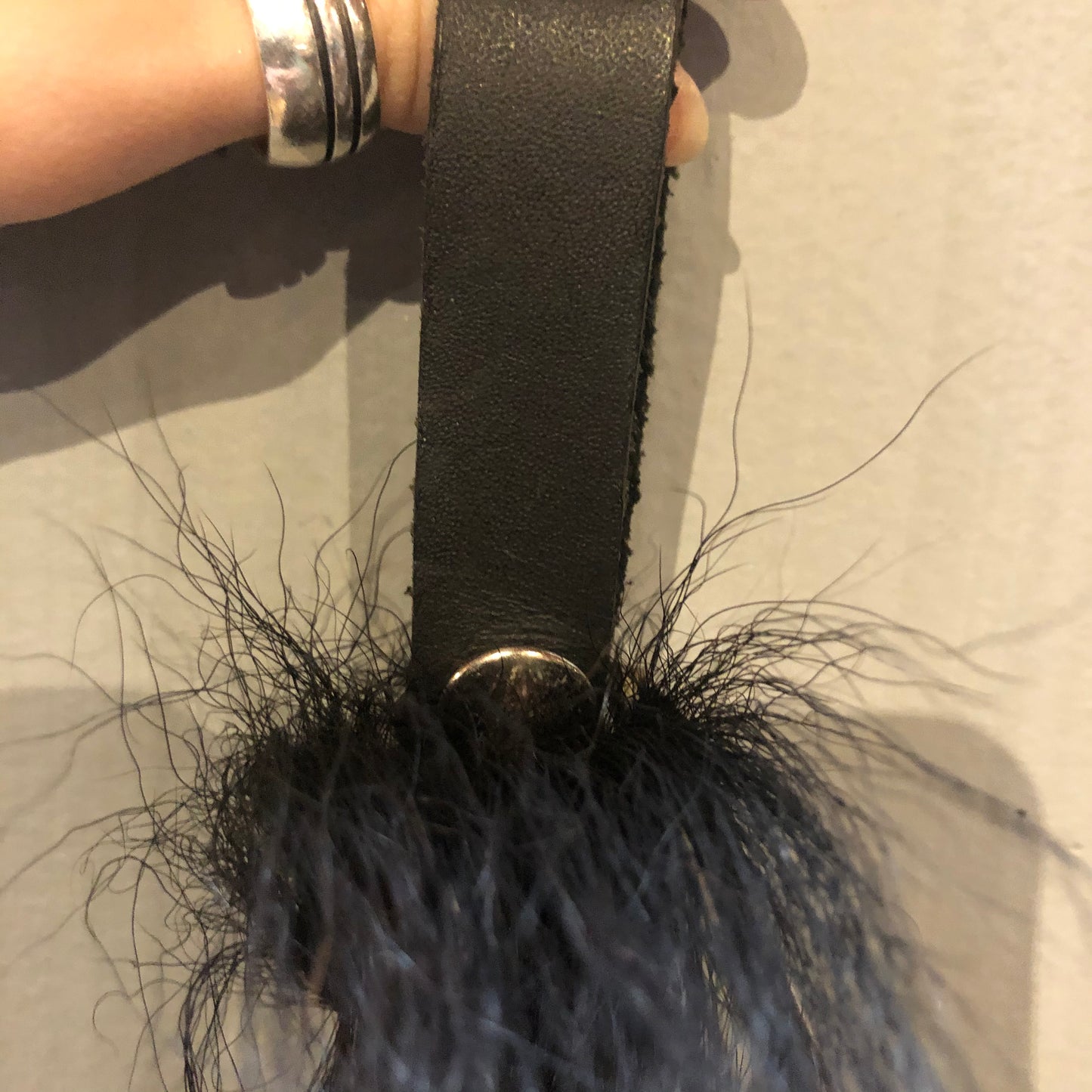 Closeup of the leather strap on the Little Pony Tail.