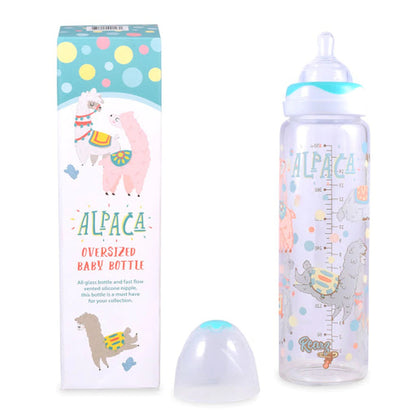 Glass Alpaca Adult Baby Bottle sitting next to its box.