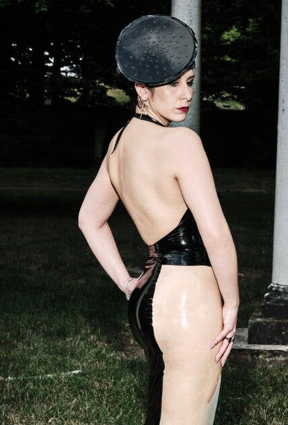 Model showing the side of the Black and Translucent Curvy Pencil Panel Skirt.