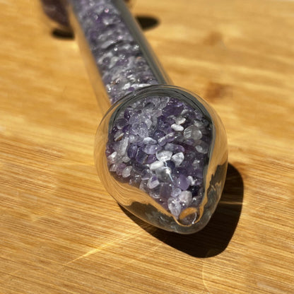 Close up of the tip of the amethyst crystal healing stone basix delight dildo.