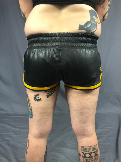 Close up of back of the black and yellow prowler leather sport shorts.