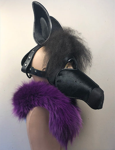 Black leather horse mask on a mannequin, right side view.
