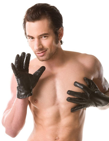 A shirtless masculine model posing with the Vampire Gloves.