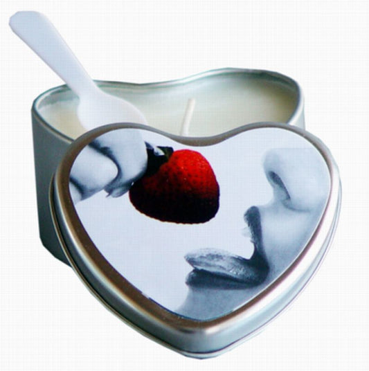 The Strawberry Earthly Body Edible Massage Candle open with its lid leaning on its side and a plastic spoon.