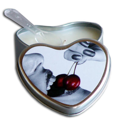 The Cherry Earthly Body Edible Massage Candle open with its lid leaning on its side and a plastic spoon.