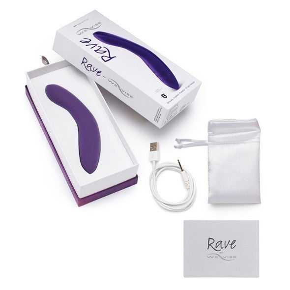 The purple We-Vibe Rave G-Spot Remote Vibrator pictured with it's box and accessories.