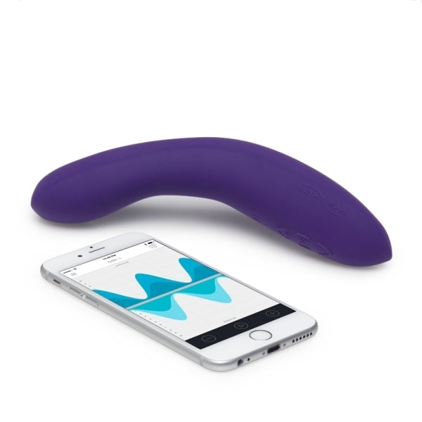 The purple We-Vibe Rave G-Spot Remote Vibrator next to a cell phone displaying the We-Vibe app. 