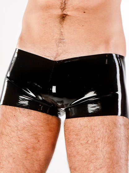 Front view of Latex Boxer Shorts in black on model.