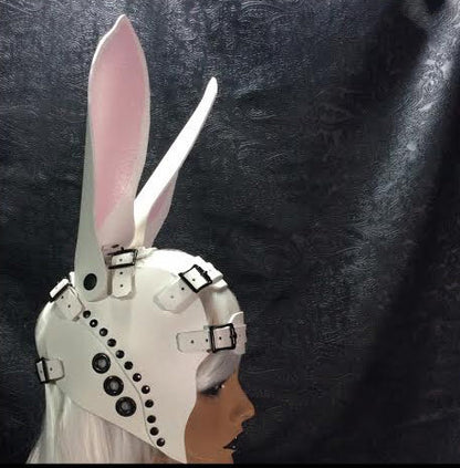 The right side of the white with pink Bunny Harness on a mannequin head.