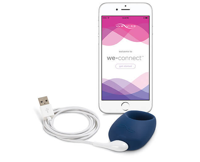 The We-Vibe Pivot Cock Ring Vibrator, its charging cable and a cellphone displaying the We-Connect app.