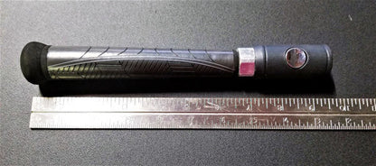 unique handle next to ruler, ten inches long