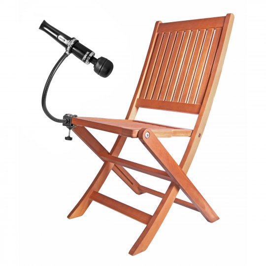 The Wand Assist Adjustable Gooseneck Wand Holder clamped to the seat of a wooden folding chair and holding a black cordless vibrating wand.