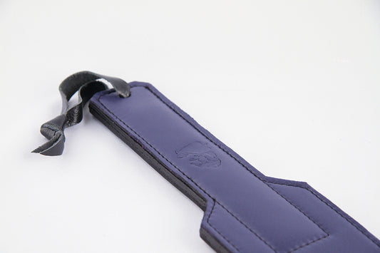 A closeup of the handle of the Prince Blurple Leather Paddle.
