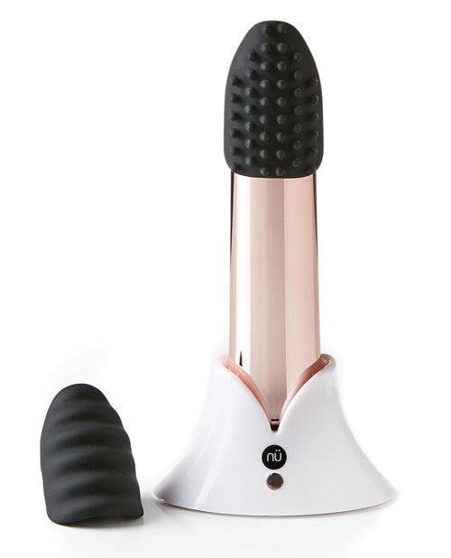 The rose gold Sensuelle Point Plus Vibrator with attachments in its stand.