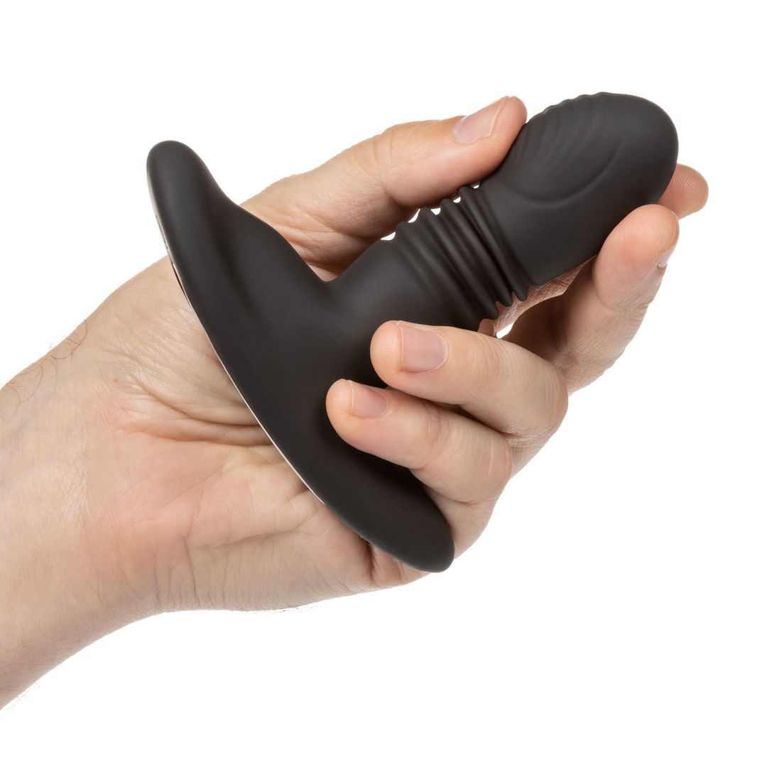 A hand holding the Eclipse Thrusting Rotator Anal Probe.
