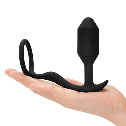 B-Vibe Snug & Tug Anal Plug and Cock Ring in black in model's hand