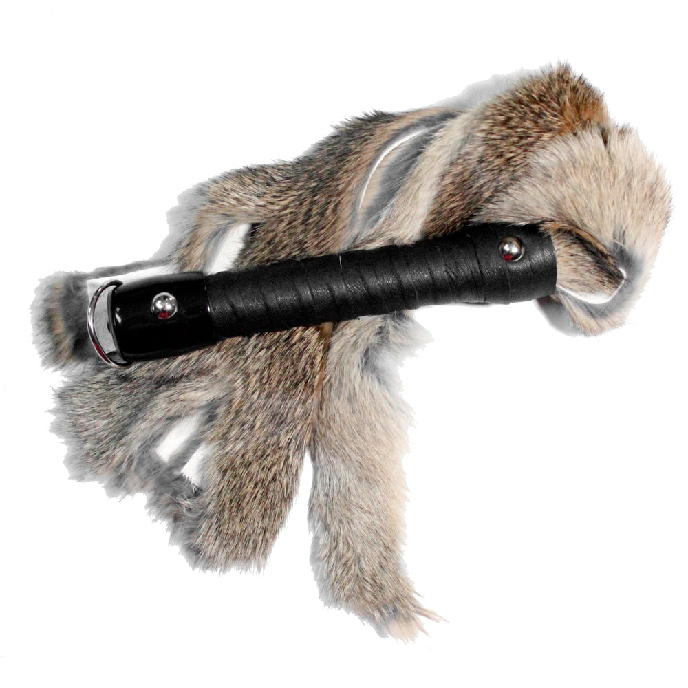 A Natural Brown Rabbit Fur Flogger with black leather handle and D-ring for hanging.