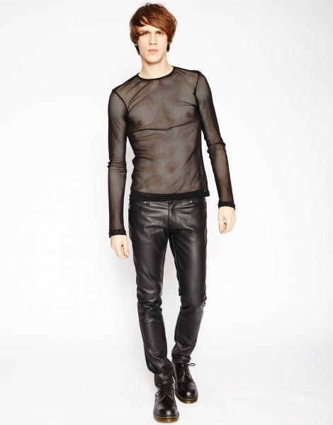 A model wearing black leather pants showing the front of the black Long Sleeve Basic Fishnet Shirt.