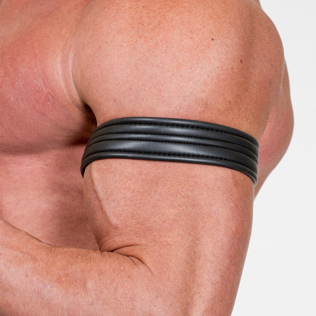 A model's muscular bicep wears the Neoprene Armband.