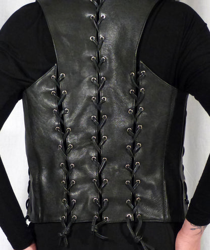 Close up of the back of the black cowhide bar vest with black laces.