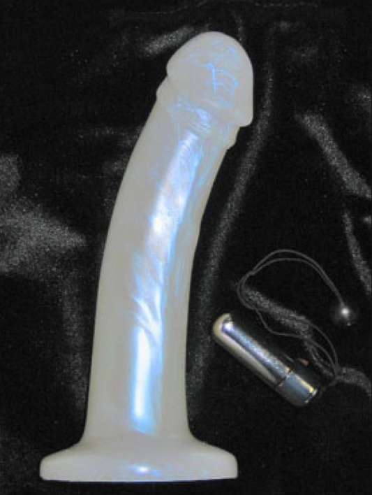 Ivory Pearl leo vibrating dildo with silver bullet vibe next to it