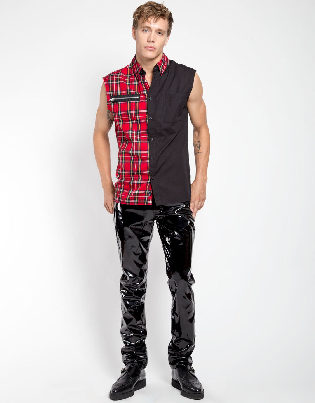 The The Classic Vinyl Pant on a model wearing a two tone plaid and black sleeveless shirt, front view.