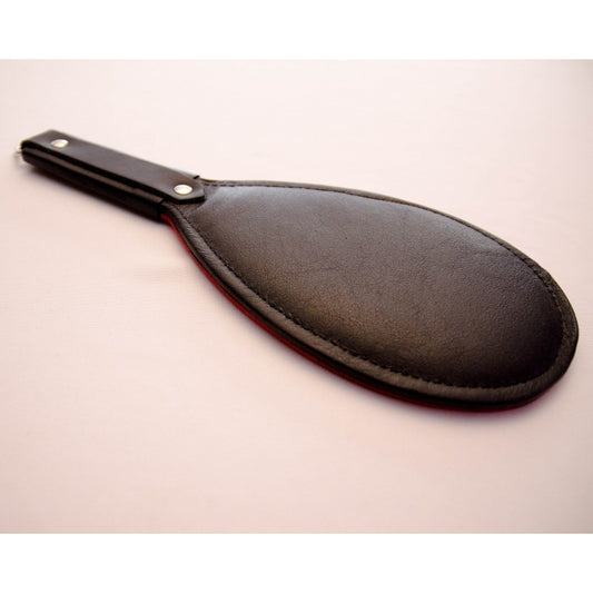 Black round paddle.