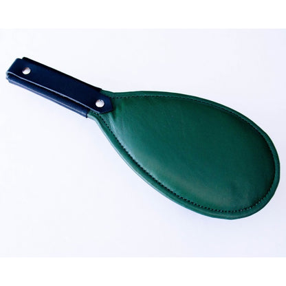 Green round paddle with black handle.