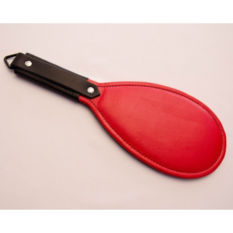 Red round paddle with black handle.