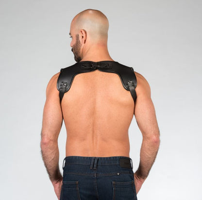 A shirtless masculine model shows the back of the Carpenter Suspender Harness.