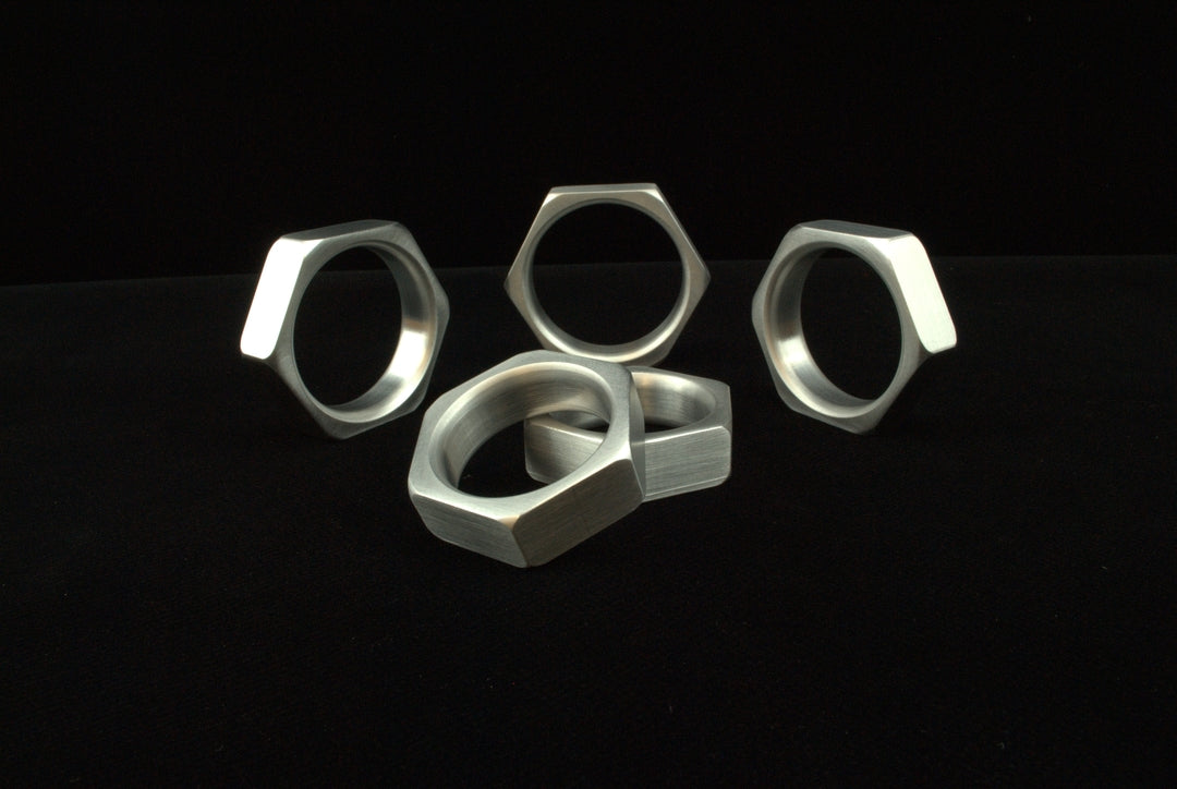 An assortment of Aluminum Cock-Nut Cock Rings.