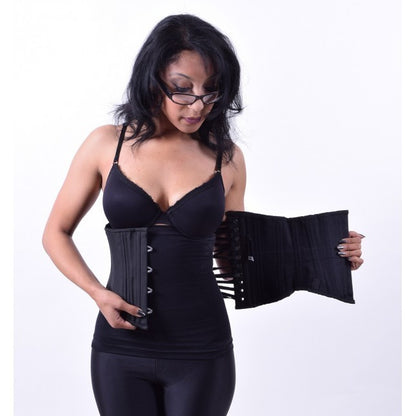 A model in black bra and stretch pants showing how a black corset would look and fit over the black Corset Liner.