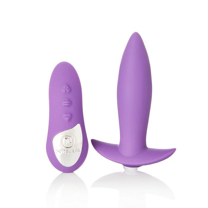 The purple Sensuelle Remote Control Mini Butt Plug Vibrator with remote.